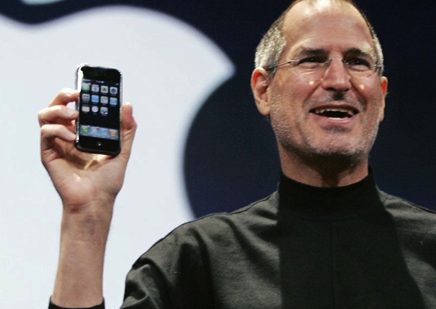 Steve Jobs holding original iPhone